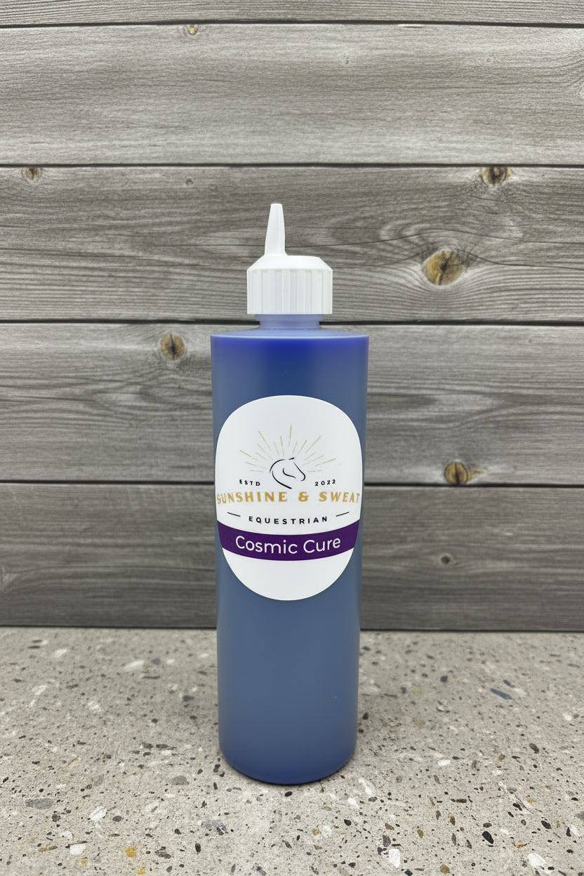 Bottle of 'Cosmic Cure' with a label on a black and white background