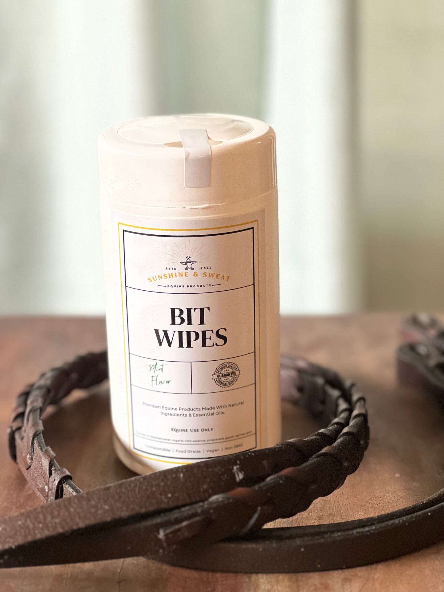 MintBit wipes in cylider container on wood table
